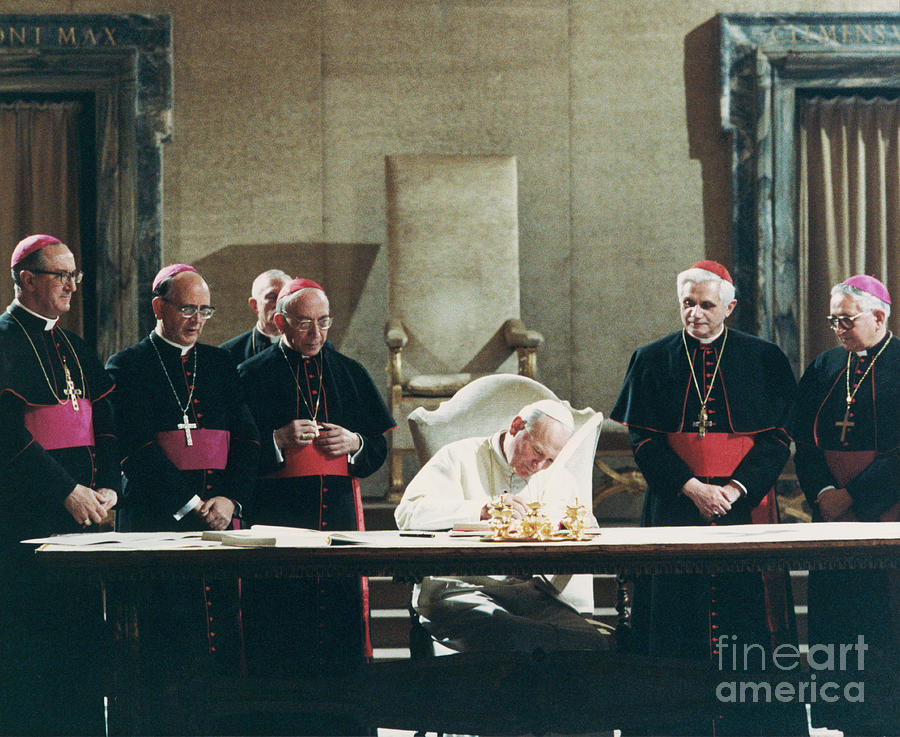 Pope John Paul II Signs Law Photograph by Bettmann