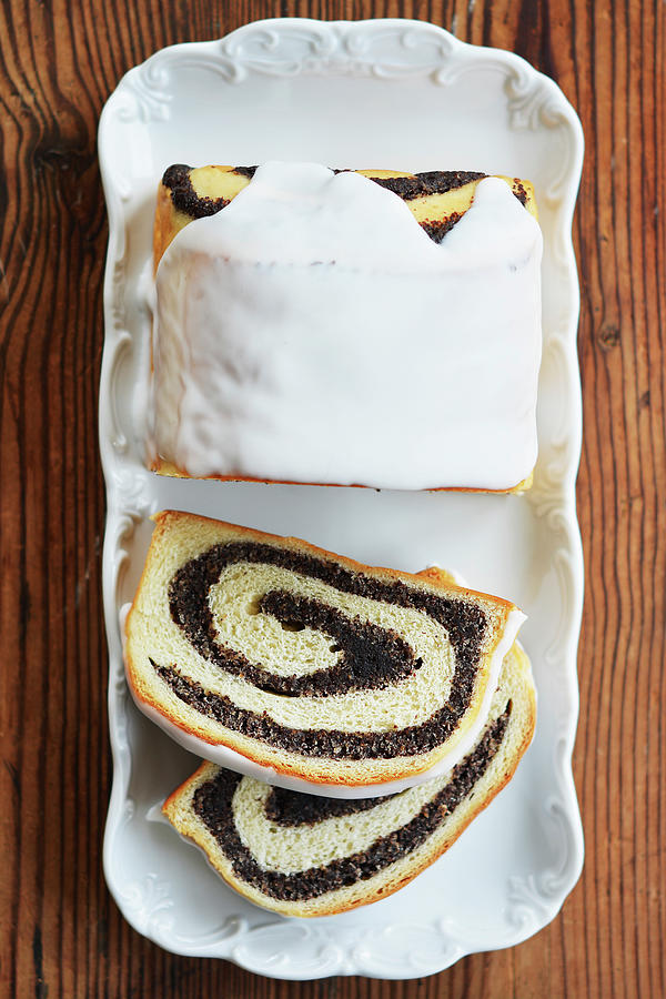 Poppy Seed Cake With Icing And Two Slices Cut Off Photograph by Mariola Streim