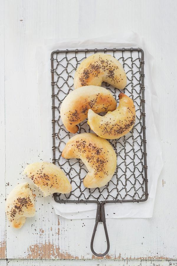 Poppy Seed Crescent Rolls On A Wire Rack Photograph by Sandra Eckhardt