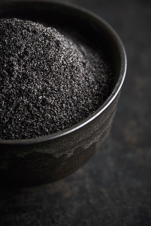 Poppy Seeds In A Black Bowl Photograph by Sylvia Meyborg