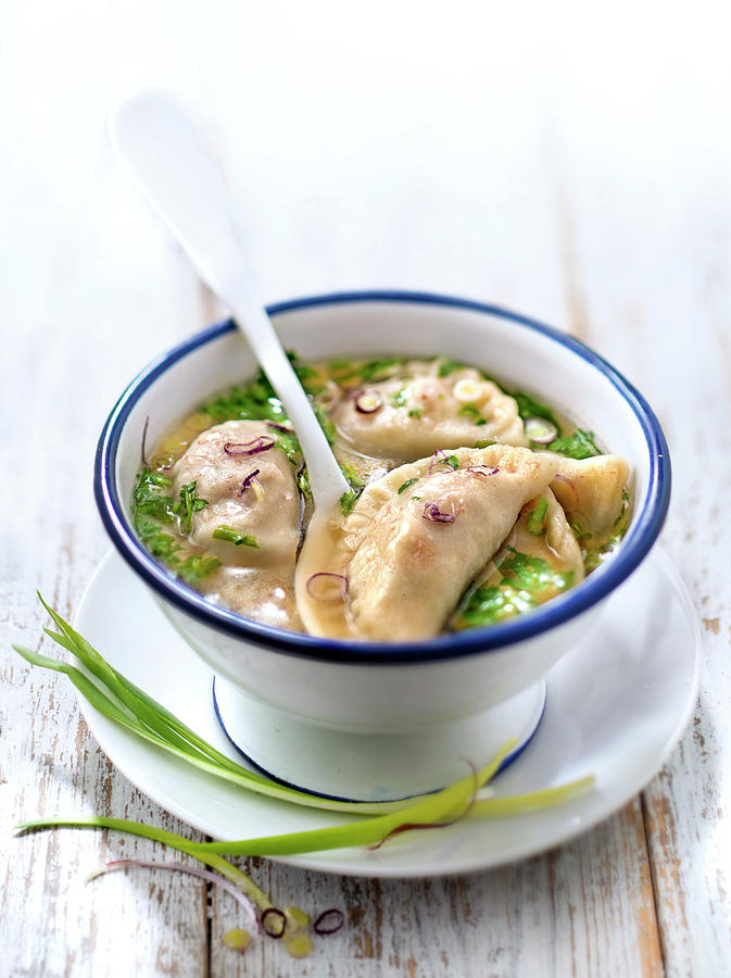 Pork And Red Onion Pelmeni With Vegetable Broth Photograph by Studio