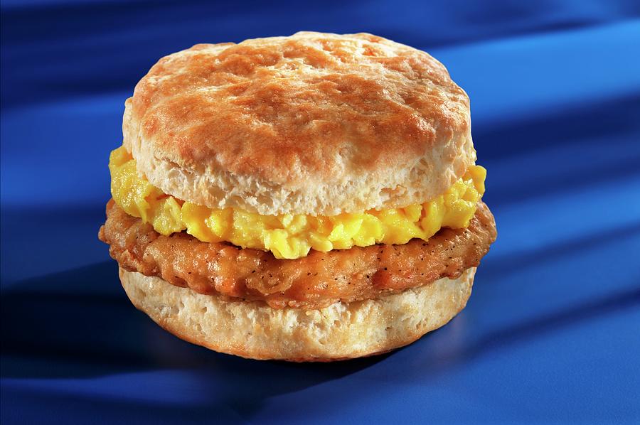 Pork And Scrambled Eggs On An American Biscuit Photograph by Colin Cooke