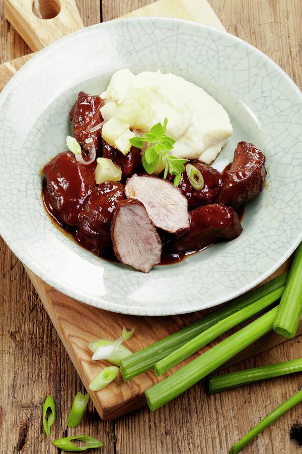 Pork Cheeks In A Red Wine Sauce With Mashed Potatoes Photograph by Bjrn Llf
