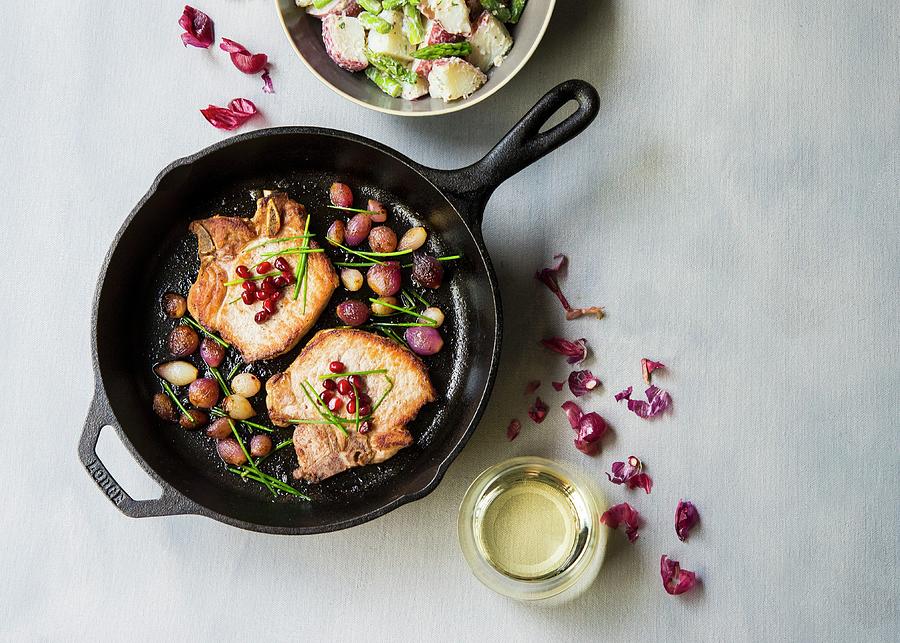 Pork Chops With Pearl Onions And Pomegranate Seeds Photograph by Lisa Rees