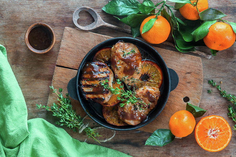 Pork Chops With Tangerines Photograph by Irina Meliukh