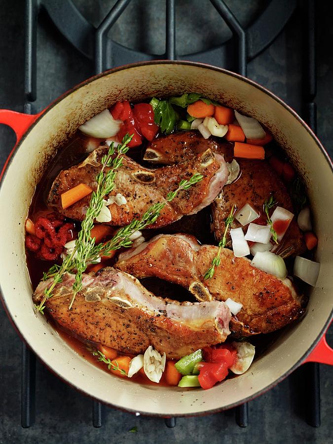 Pork Chops With Vegetables In A Braising Dish Photograph by Jim Franco Photography