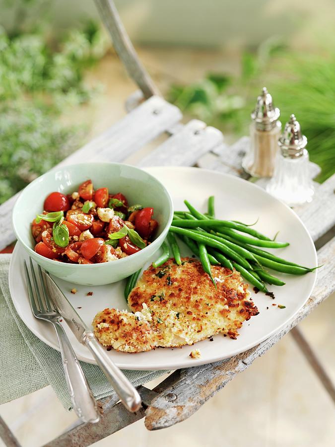 Pork Cutlet With Tomato-basil Salsa And Green Beans Photograph by Gareth Morgans