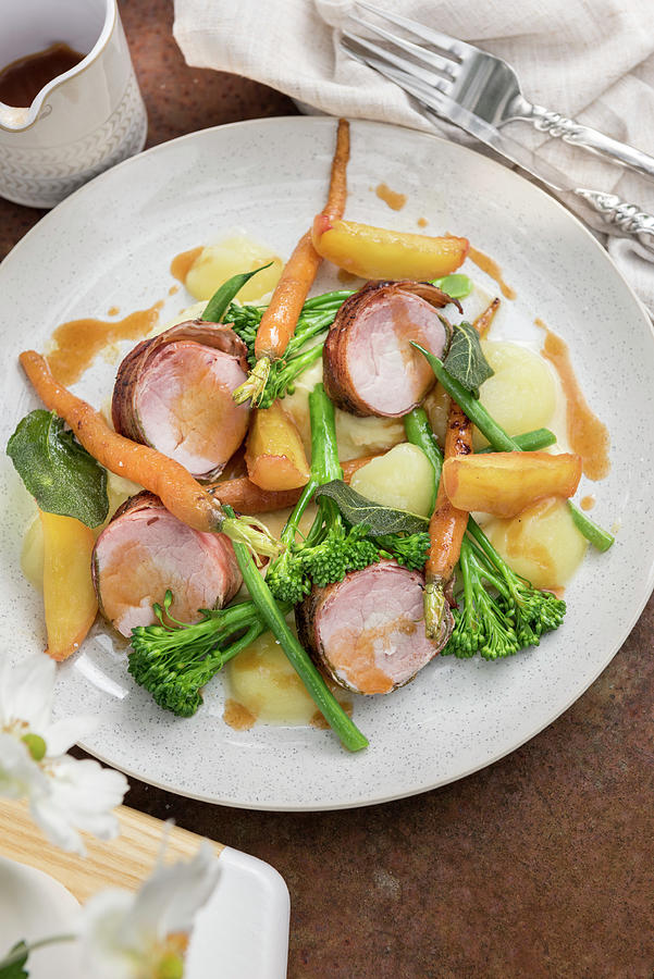 Pork Fillet In A Bacon And Sage Coating Photograph by Winfried Heinze