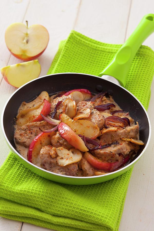 Pork Fillet With Apple Wedges, Red Onions And Mushrooms Photograph by Studio Lipov