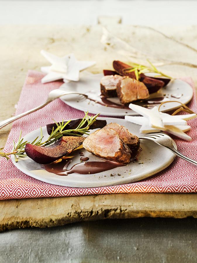 Pork Fillet With Elderberry Pears For Christmas Photograph by Manfred Jahrei