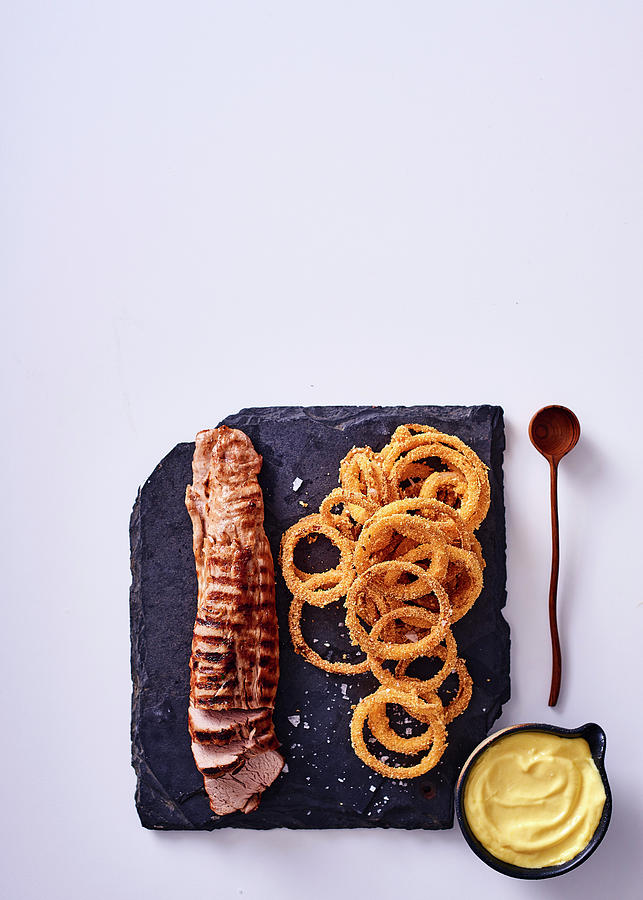 Pork Fillet With Polenta Coated Onion Rings And Aioli Photograph by Great Stock!