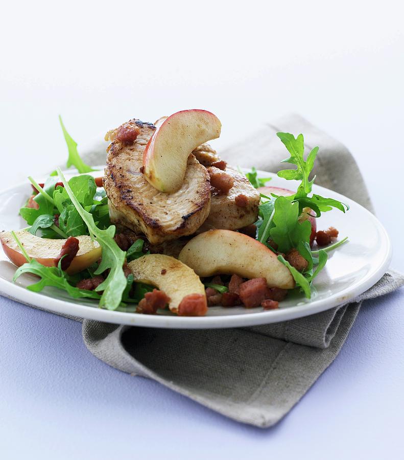 Pork Fillet With Steamed Apples, Bacon And Rocket Photograph by Mikkel Adsbl
