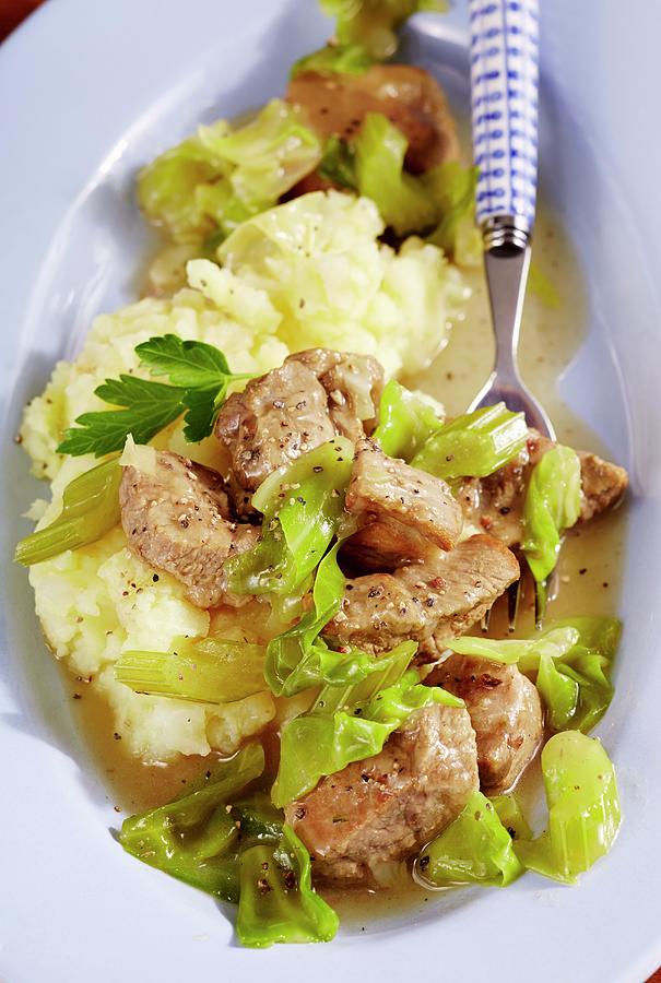 Pork Goulash With Pointed Cabbage On A Bed Of Mashed Potatoes Photograph by Teubner Foodfoto