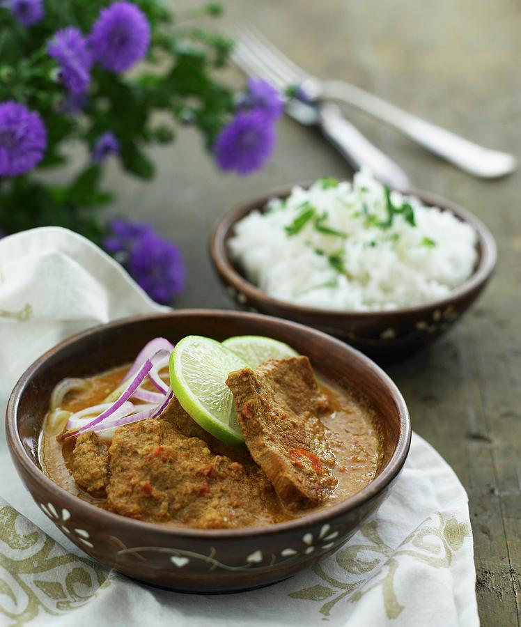 Pork In A Red Curry Sauce With Rice Photograph by Mikkel Adsbl