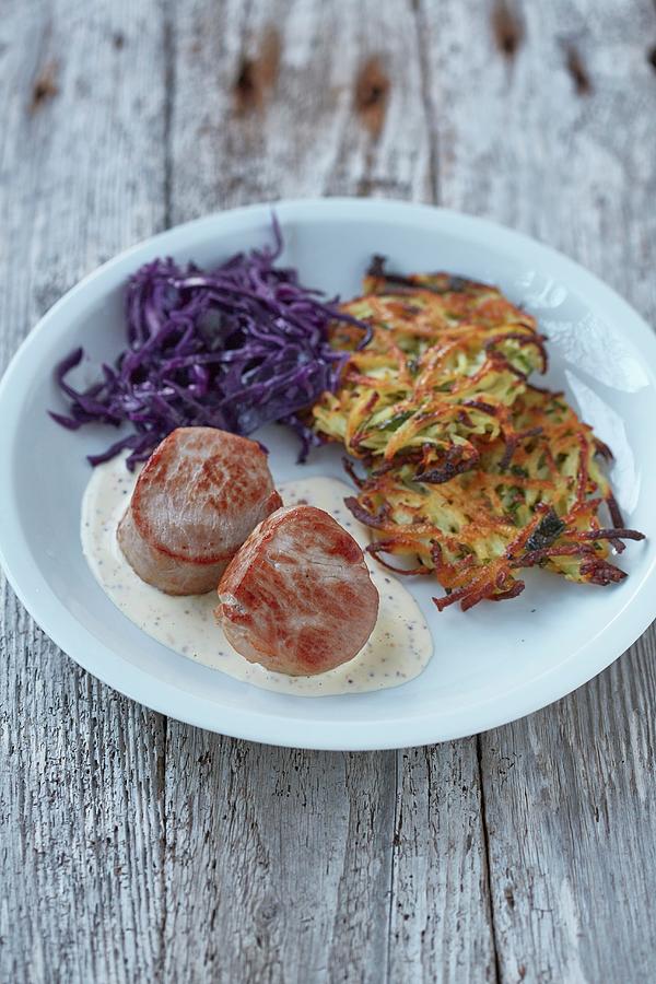 Pork Medallions With A Creamy Mustard Sauce Served With A Potato And Apple Cakes And Red Cabbage Photograph by Clive Streeter