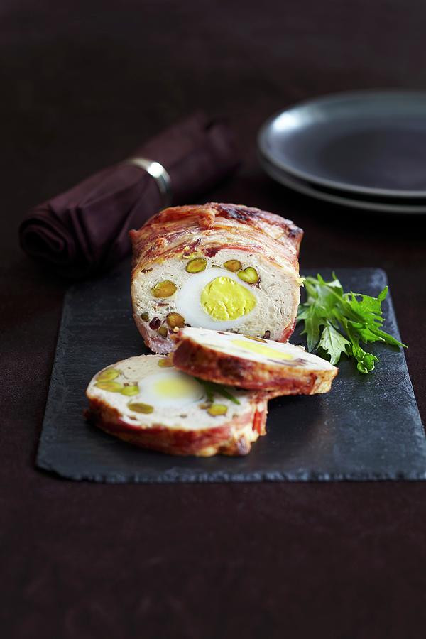 Pork Roulade Filled With Pistachios And Eggs Wrapped In Crispy Bacon Photograph by Charlotte Tolhurst