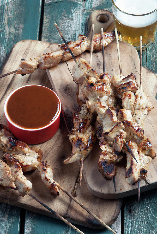 Pork Skewers Served With Bbq Sauce And Beer Photograph by Spyros Bourboulis