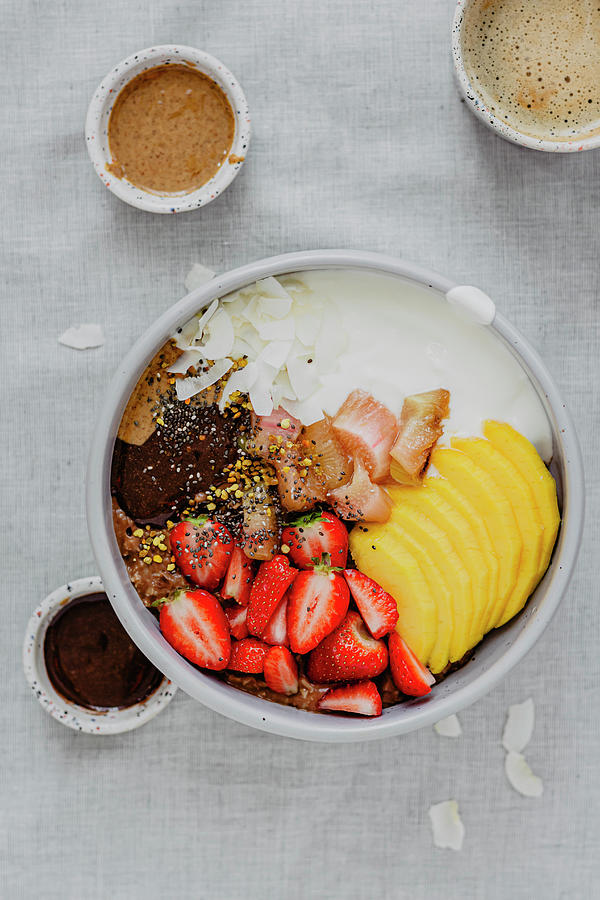 Porridge With Mango And Strawberries Photograph by Monika Rosa