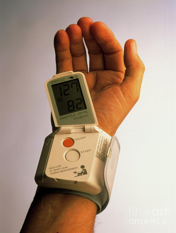 Portable Blood Pressure Device On Man's Wrist Photograph by Oscar ...