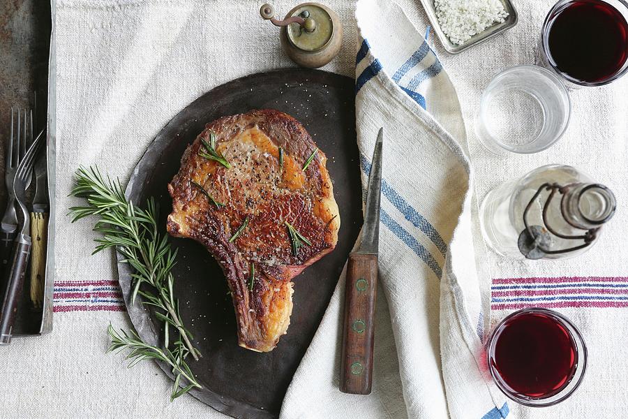 Porterhouse Steak With Rosemary And Red Wine Photograph by Shell