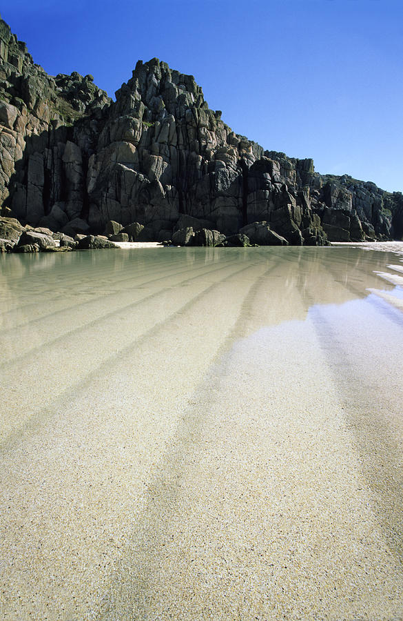 Porthcurno Beach At Low Tide Photograph by David Clapp