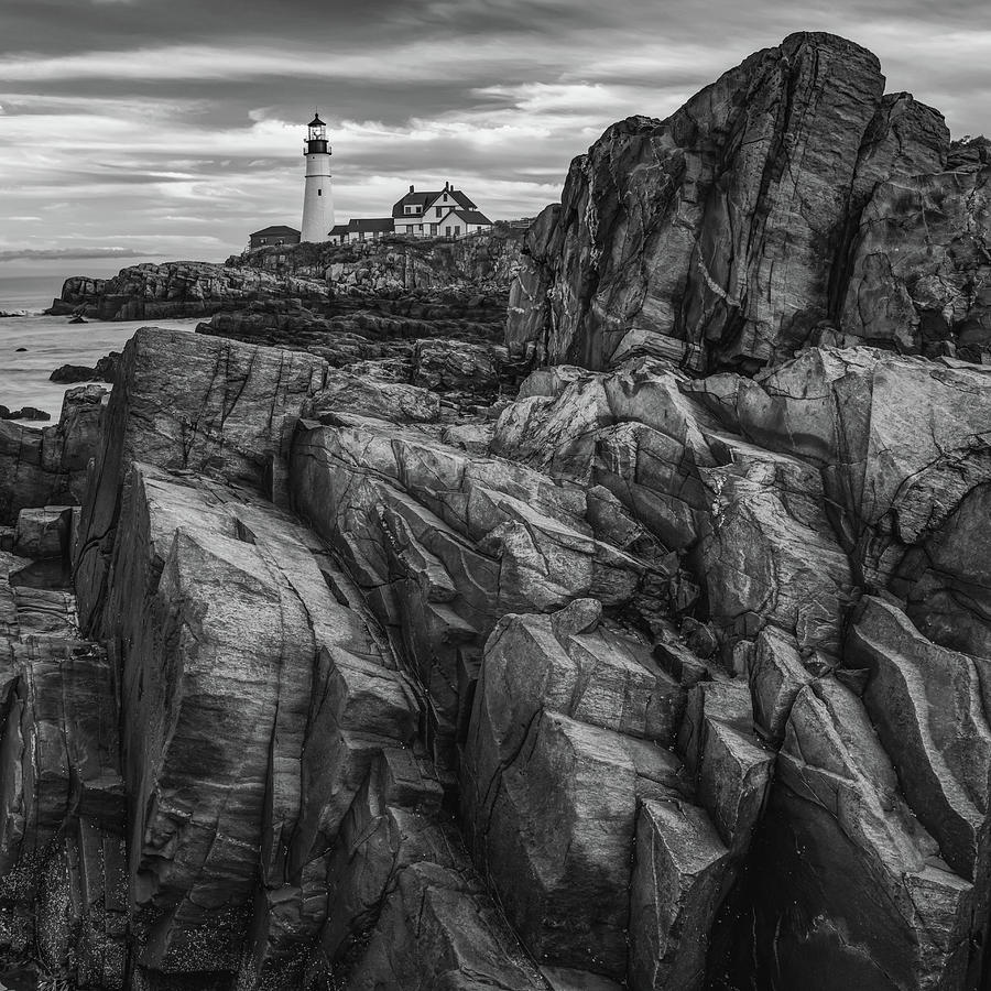 Black And White Photograph - Portland Head Light and Jagged Rocky Coast in Monochrome by Gregory Ballos