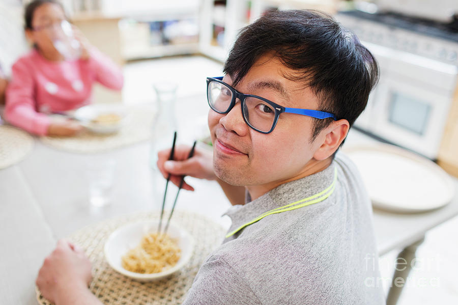 Portrait Man Eating Noodles With Chopsticks Photograph by Caia Image ...