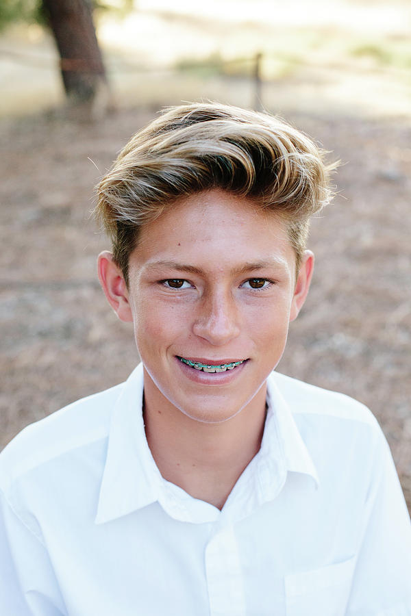 Portrait Of A Handsome Teen Boy With Brown Eyes And Braces Photograph by  Cavan Images - Fine Art America