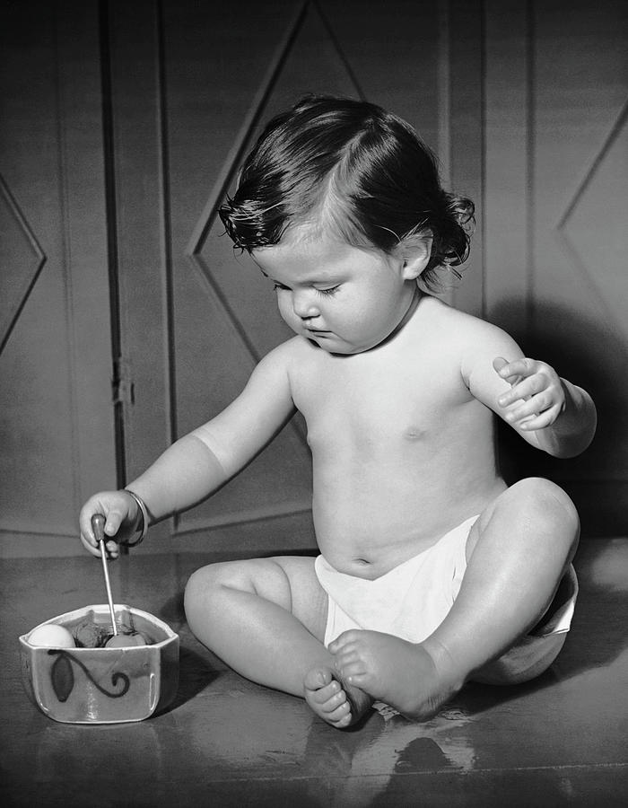 Black And White Photograph - Portrait Of Baby Playing Wtoys by George Marks