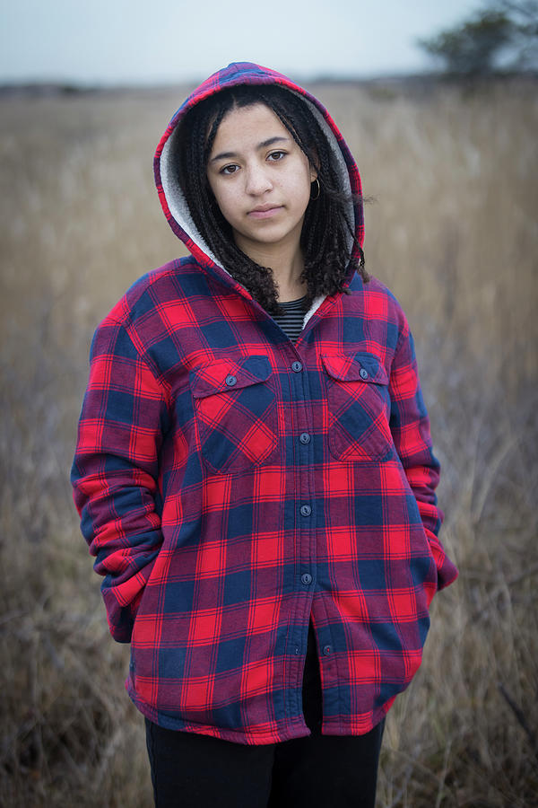 Portrait Of Biracial Young Woman Looking Sad With Braids And Hood ...