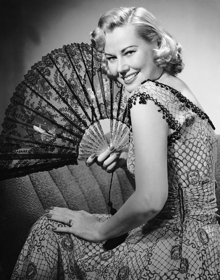Portrait Of Blonde Woman Holding Fan Photograph by George Marks