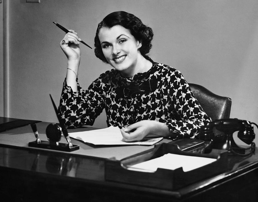 Portrait Of Businesswoman At Desk Photograph by George Marks