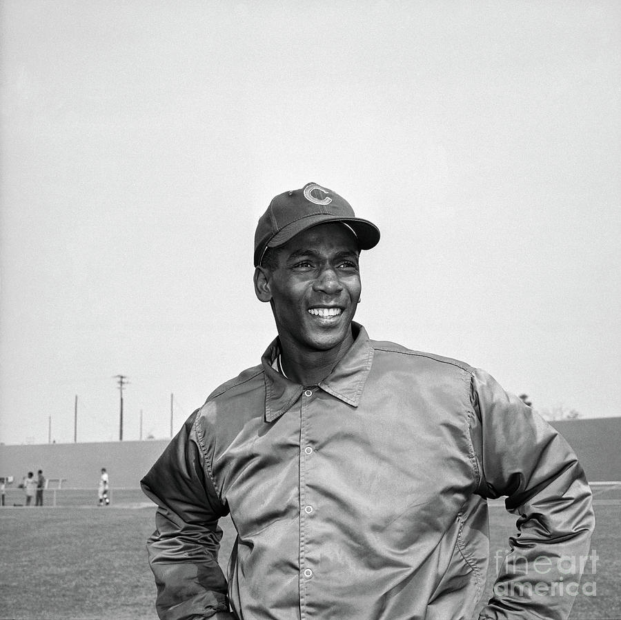 Ernie Banks Holding Baseball Bat by Bettmann