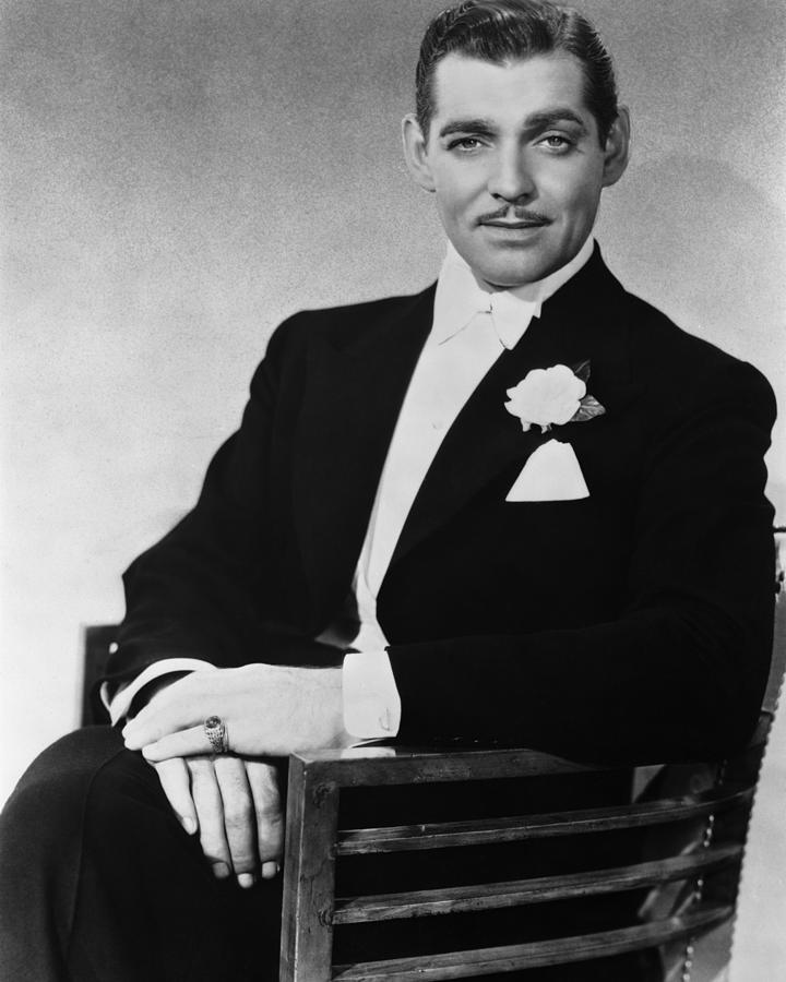 Portrait Of Clark Gable Sitting On Chair Photograph by Globe Photos ...