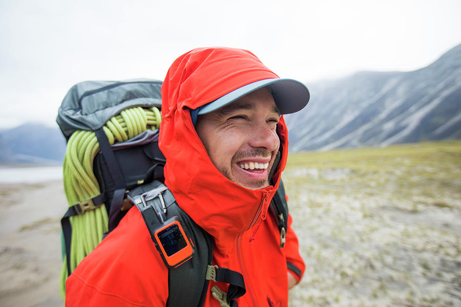 Portrait Of Happy Backpacker With Red Rain Jacket On. Photograph by ...