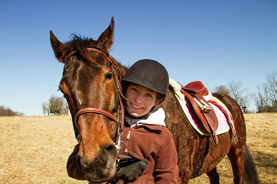 Portrait Of Happy Boy With Horse Standing On Field Against Clear Sky Photograph by Cavan Images