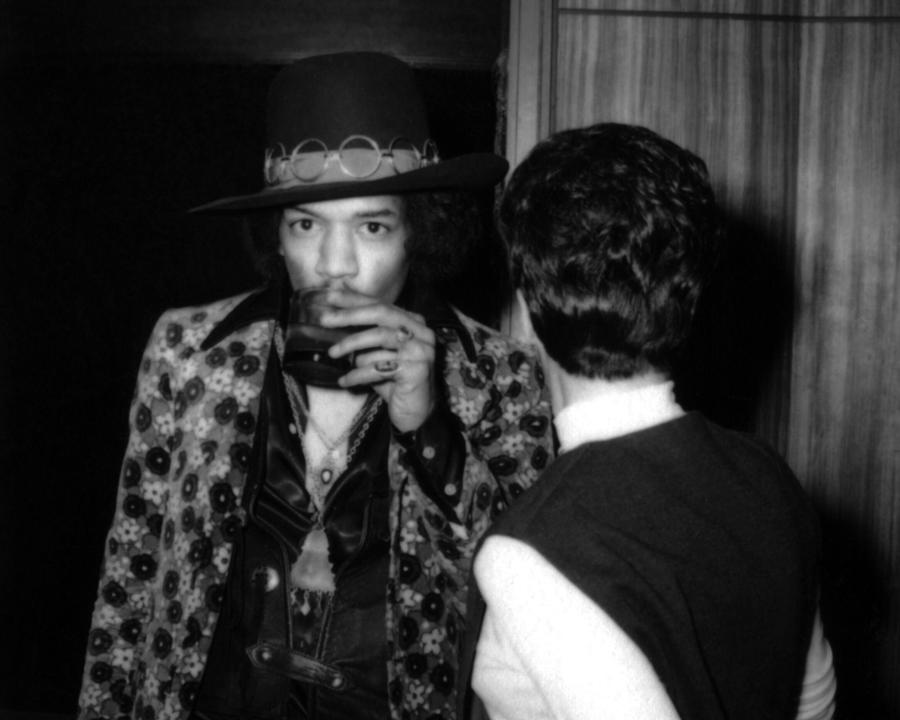 Jimi Hendrix Photograph - Portrait Of Jimi Hendrix Drinking Alcohol Backstage by Globe Photos