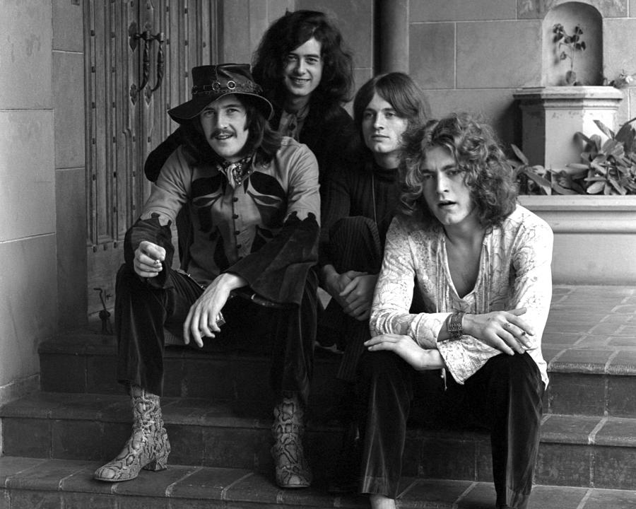 Robert Plant Photograph - Portrait Of Led Zeppelin Band Members Sitting On Steps At Chateau Marmont by Globe Photos