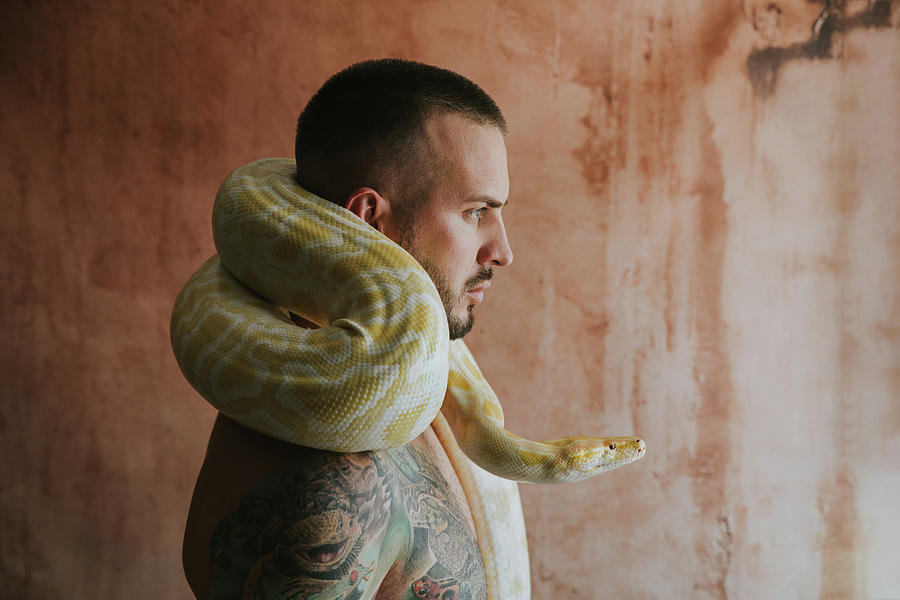 Snake Photograph - Portrait Of Man With Python Circling His Neck by Cavan Images