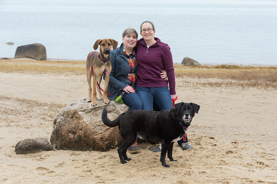 Dog Photograph - Portrait Of Same Sex Female Couple With Two Dogs On Cape Cod Beach by Cavan Images