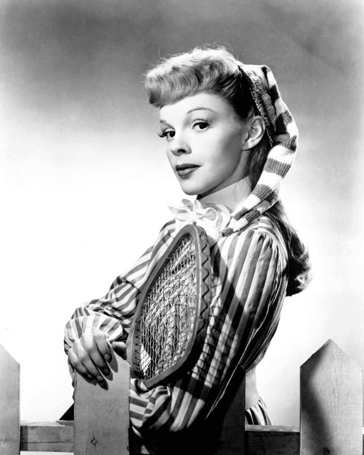 Portrait Of Smiling Judy Garland Standing By Picket Fence Photograph by ...