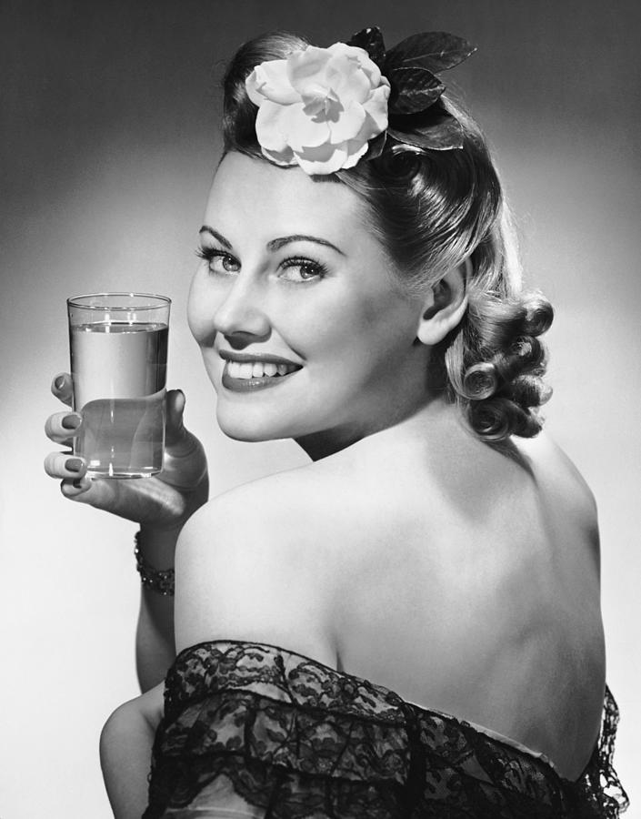 Portrait Of Woman Holding Glass Of Water Photograph by George Marks
