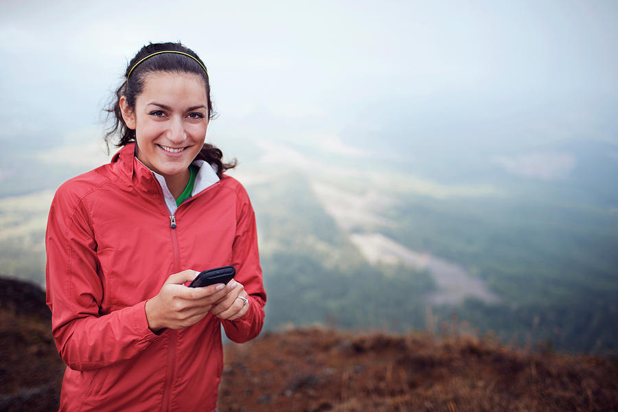 Portrait Of Woman Text Messaging While Standing On Mountain Photograph ...