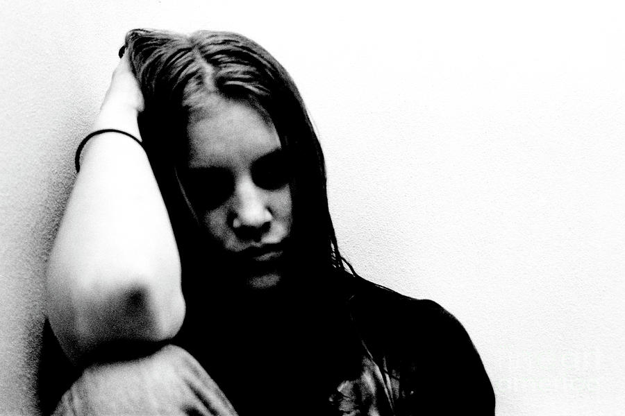 Portrait young woman feeling very depressed by Guido Koppes Portrait young woman feeling very depressed by Guido Koppes