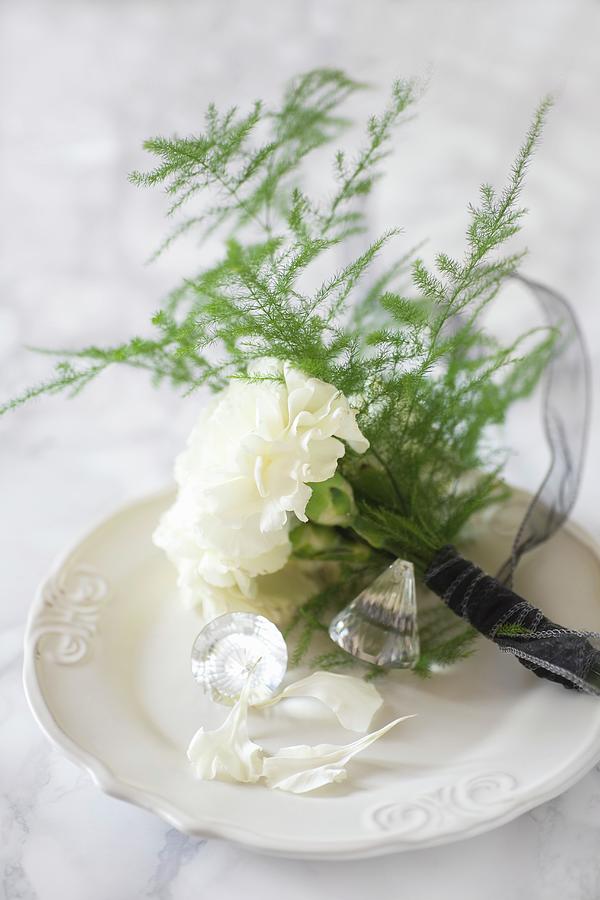 Posy Of Carnations, Asparagus Fern And Crystal On China Plate Photograph by Alicja Koll
