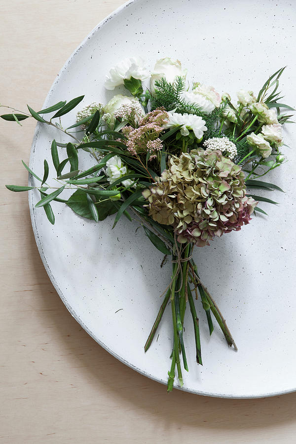 Posy Of Hydrangea, Dahlia, Carnation, Roses And Olive Branch Decorating Plate Photograph by Hej.hem Interior