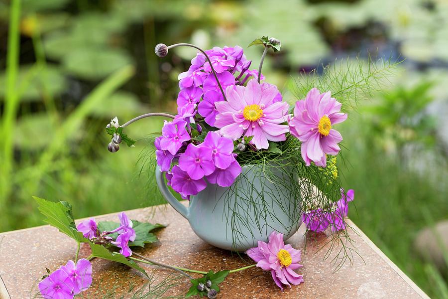 Posy Of Japanese Anemones And Fennel Leaves On Table In Garden Photograph by Sabine Lscher