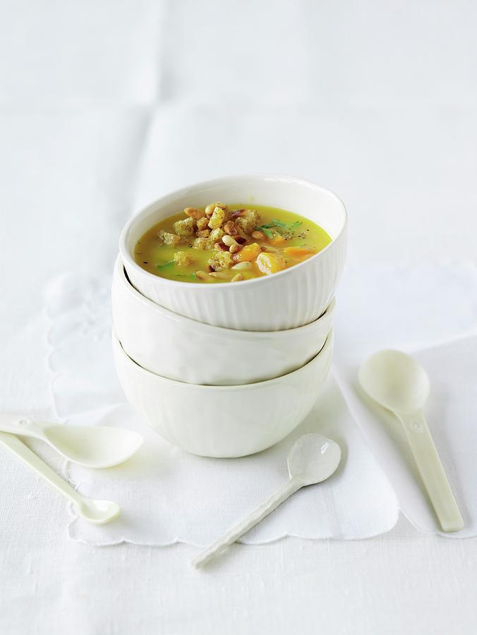 Potato And Apricot Soup With Croutons And Pine Nuts Photograph by Jalag / Janne Peters