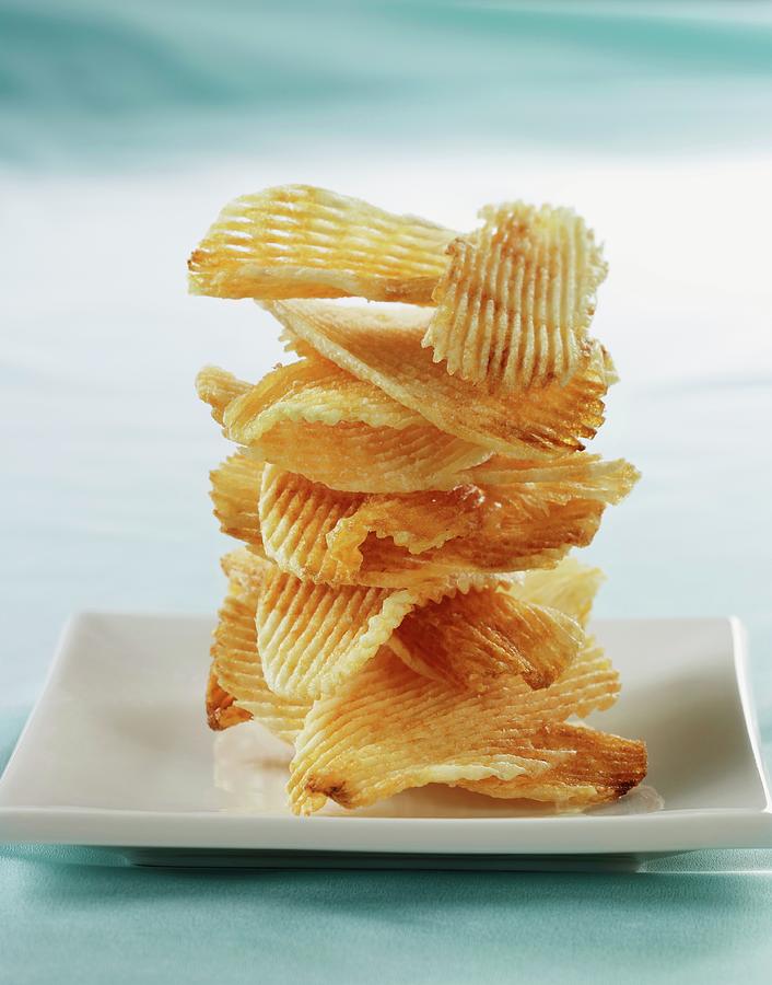 Potato Chips Stacked On A White Plate Photograph by Comet, Rene