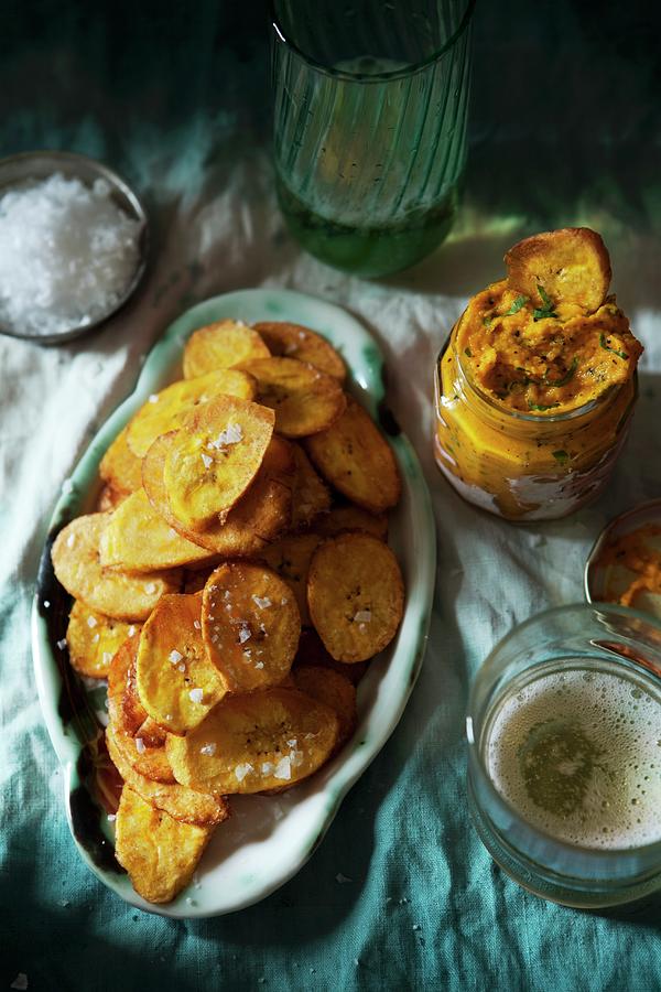 Potato Crisps With A Carrot And Coriander Dip Photograph by Ulrika Ekblom